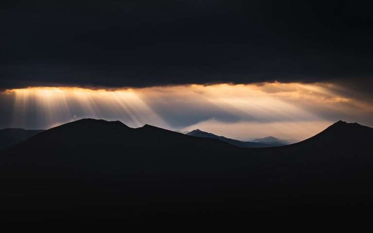 silhouette of mountains during sunset